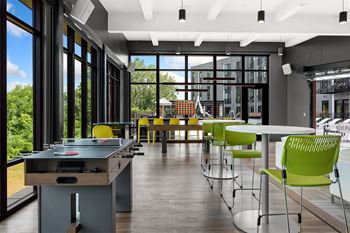 a room filled with furniture and a large window